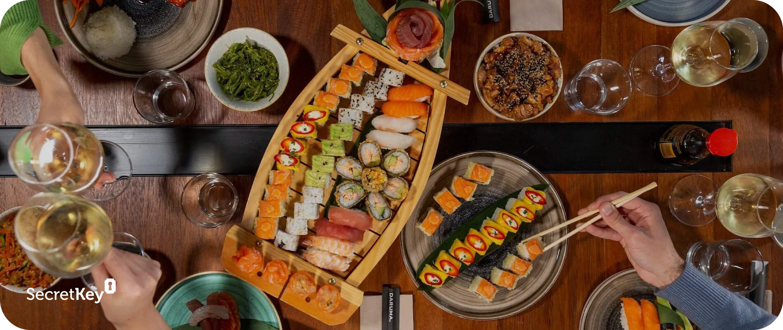 Sushi and wine in Italy: discover the best restaurant marketing agencies, with a photo of assorted sushi and wine glasses.