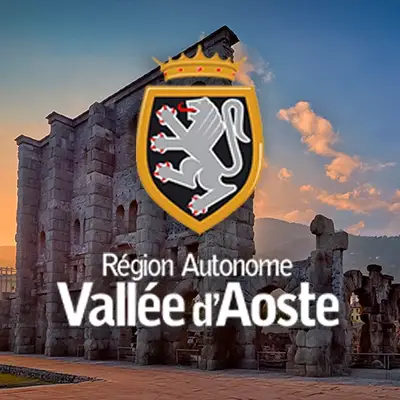 Valle d'Aosta: logo della regione autonoma con rovine romane di Aosta sullo sfondo. Turismo e cultura in Valle d'Aosta.